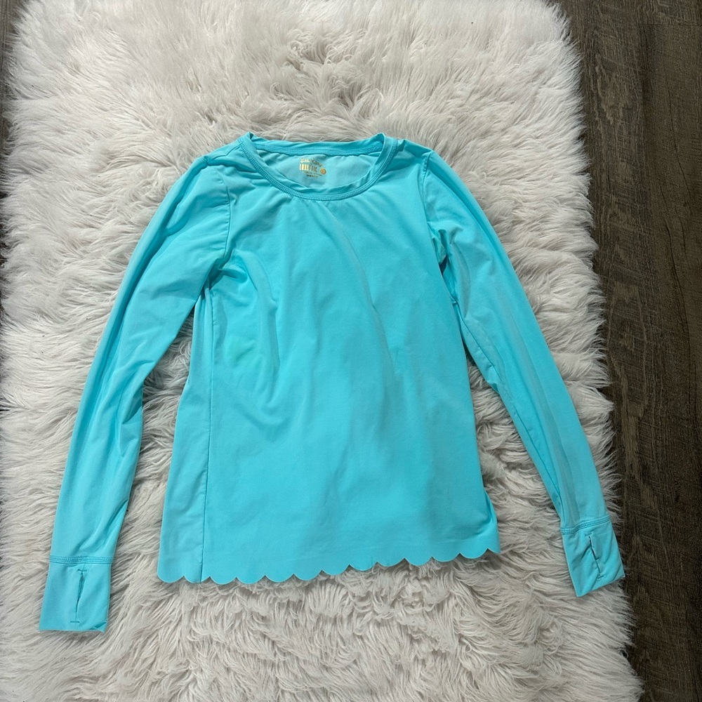 Lilly Pulitzer. Blue, scalloped, Luxletic, long sleeved top. Size XS